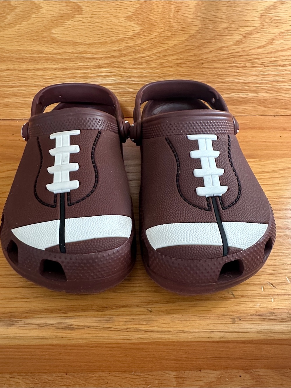 CROCS Kids Brown Clog with White Football Accents
